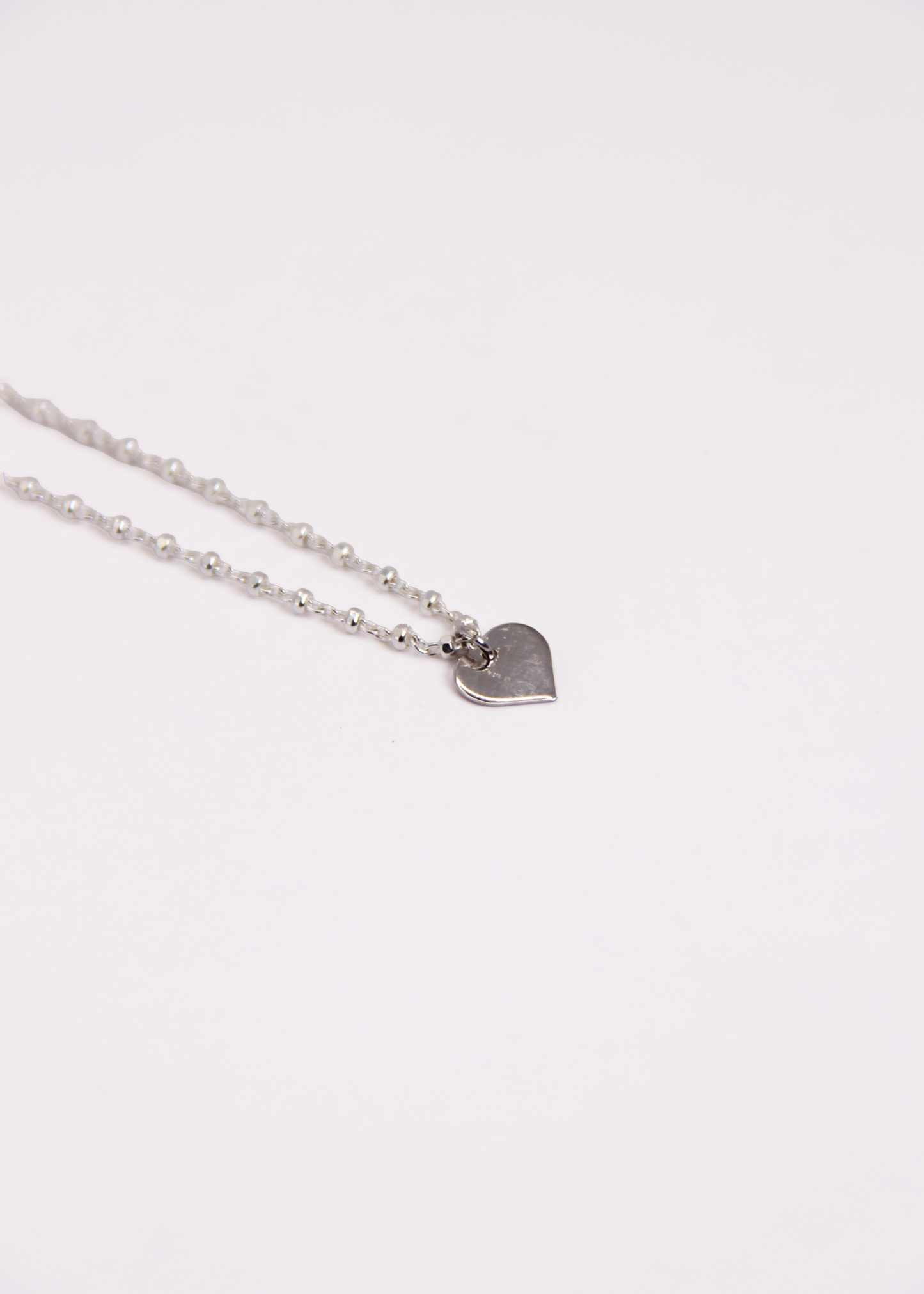 Bracciale con mini ciondolo in argento