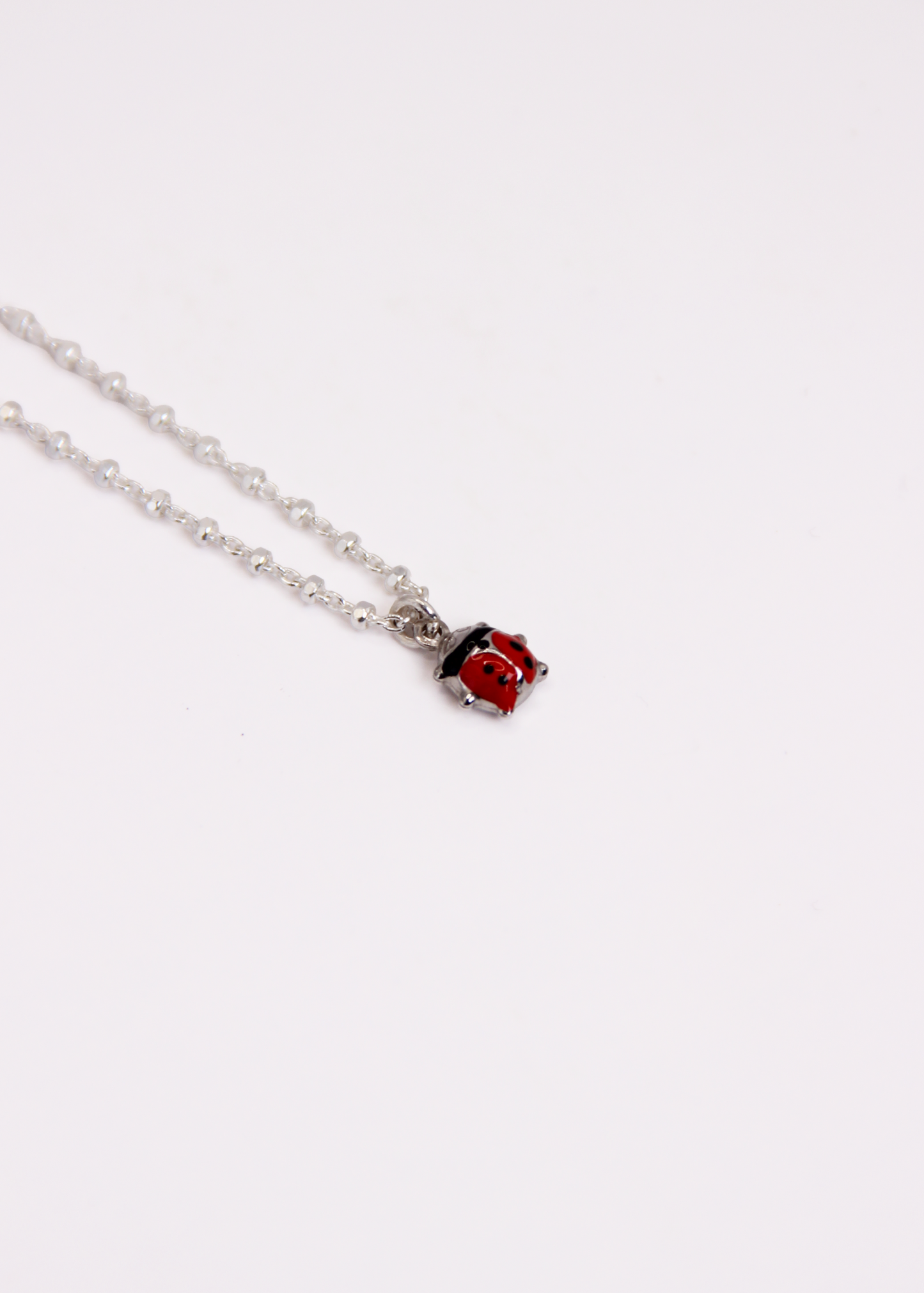 Bracciale con mini ciondolo in argento