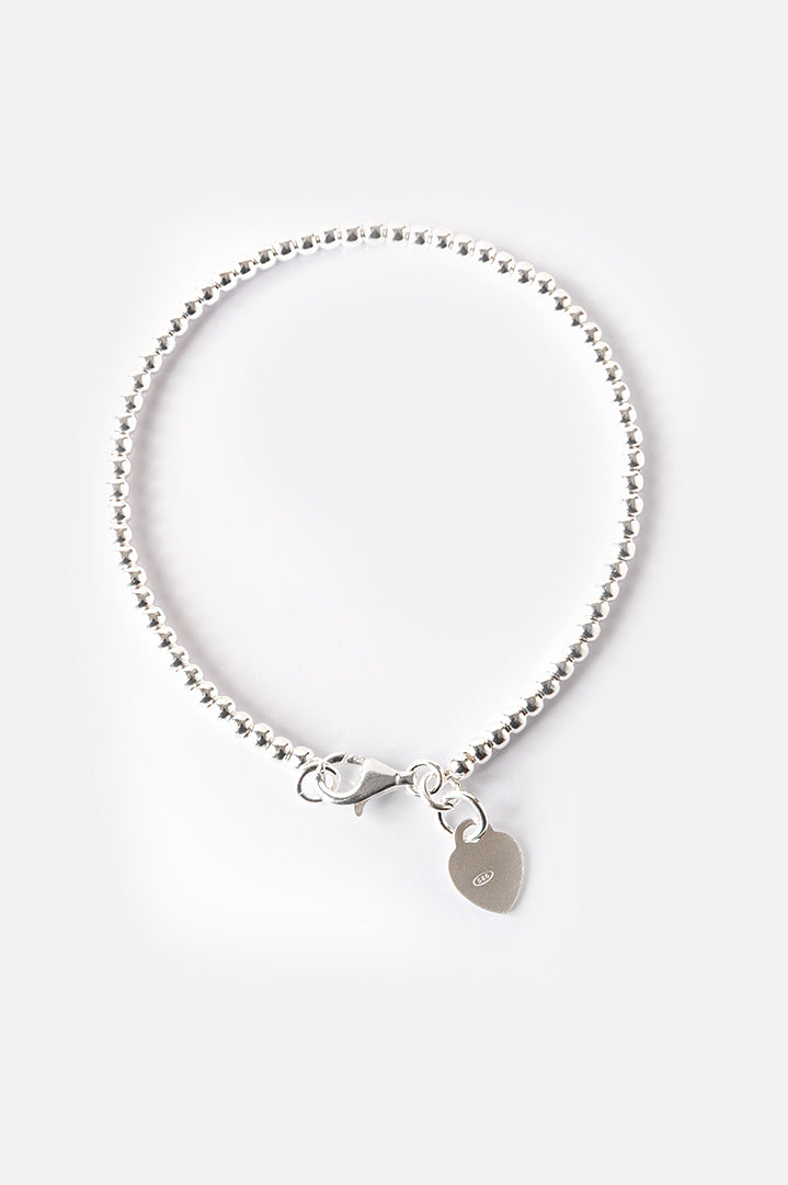 Silver bracelet with small beads and letter